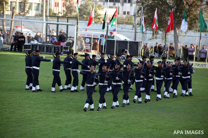 Graduating police officers march during a ceremony at the police academy in Gaza City on June 13, 2012, making them the first batch of officers to graduate after four years of training under the Hamas leadership. Hamas h...