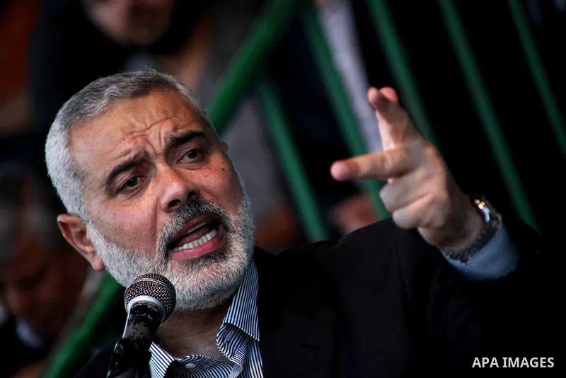 Palestinian Prime Minister in Gaza Ismail Hanyeh, speaks during a graduation police officers ceremony at the police academy in Gaza City on June 13, 2012, making them the first batch of officers to graduate after four ye...