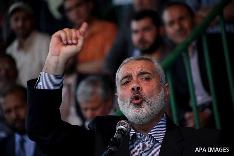 Palestinian Prime Minister in Gaza Ismail Hanyeh, speaks during a graduation police officers ceremony at the police academy in Gaza City on June 13, 2012, making them the first batch of officers to graduate after four ye...