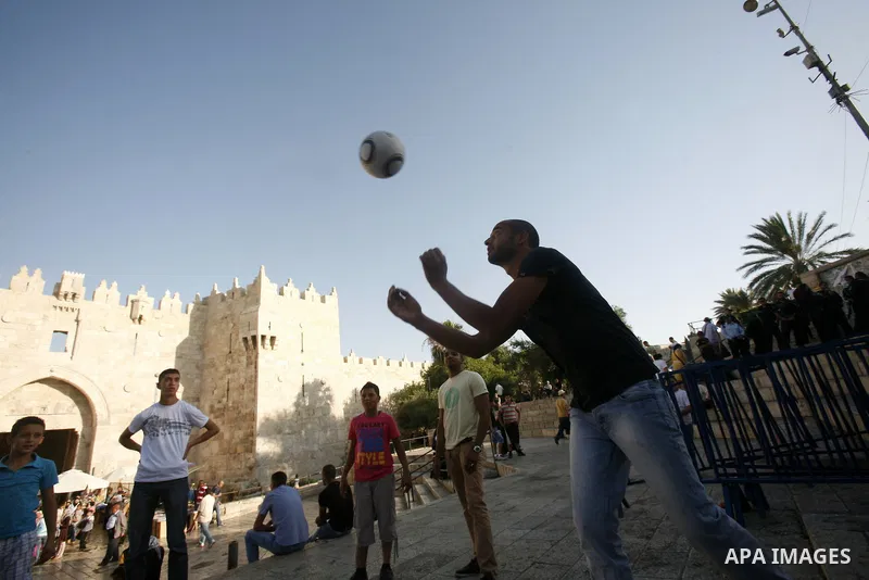 Palestinians play football at Al-Aqsa mosque in the old city of Jerusalem on 12 June 2012. FIFA president Sepp Blatter has expressed grave concern over reports that several Palestinian players have been illegally detaine...
