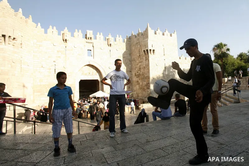 Palestinians play football at Al-Aqsa mosque in the old city of Jerusalem on 13 June 2012. FIFA president Sepp Blatter has expressed grave concern over reports that several Palestinian players have been illegally detaine...