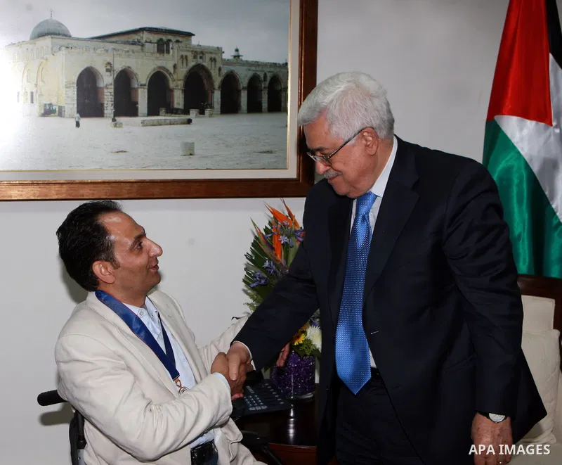 Palestinian President, Mahmoud Abbas (Abu Mazen) honors Osama Silwadi the Medal Of Merit and Excellence, in the West Bank city of Ramallah, on June 14, 2012. Photo by Thaer Ganaim