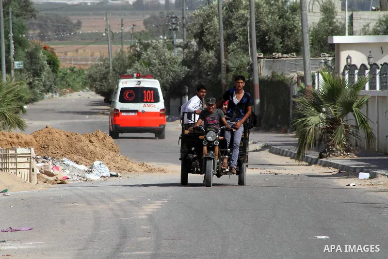 An ambulance carry injuries after raids of Israeli helicopters and tanks on Khuza'a town , in the east of Khan Younis city in the south of gaza strip, on 14 June 2012. Palestinian medical sources confirmed the presence o...