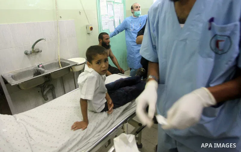 A Palestinian medic checks a wounded child at Naser hospital following an Israeli strike on June 14, 2012 in Khuza'a town , in the east of Khan Younis city in the south of gaza strip. Photo by Ashraf Amra
