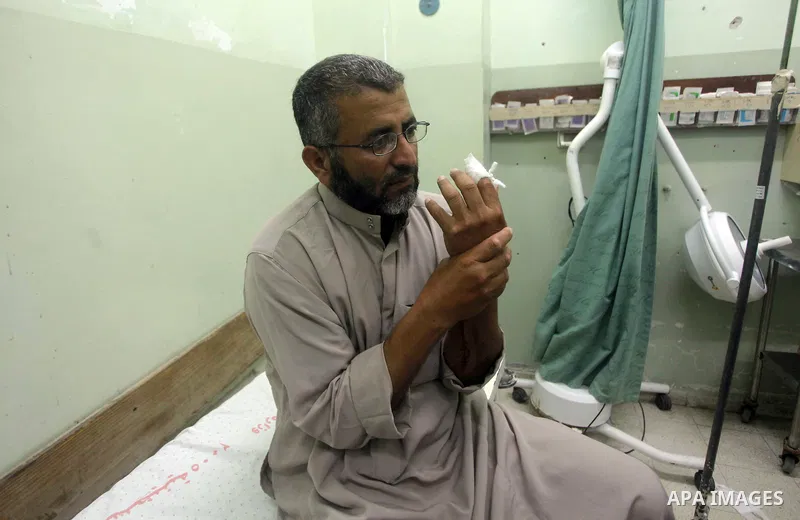 A Palestinian wounded man arrives to Naser hospital following an Israeli strike on June 14, 2012 in Khuza'a town , in the east of Khan Younis city in the south of gaza strip. Photo by Ashraf Amra
