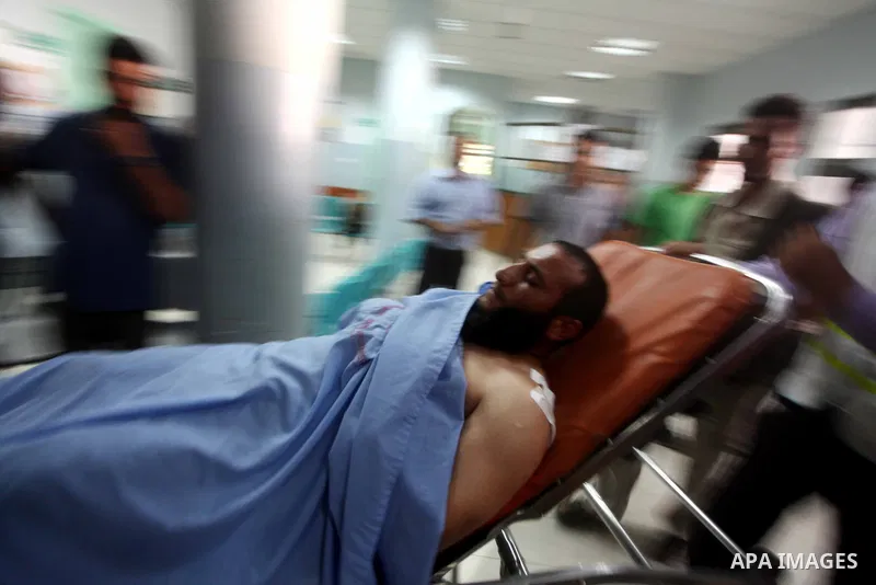 A Palestinian wounded man arrives to Naser hospital following an Israeli strike on June 14, 2012 in Khuza'a town , in the east of Khan Younis city in the south of gaza strip. Photo by Ashraf Amra