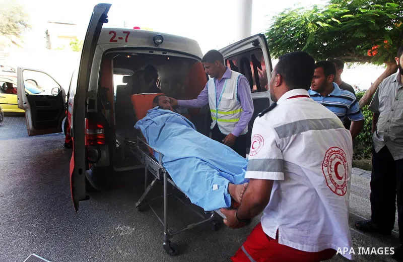 A Palestinian wounded man arrives to Naser hospital following an Israeli strike on June 14, 2012 in Khuza'a town , in the east of Khan Younis city in the south of gaza strip. Photo by Ashraf Amra