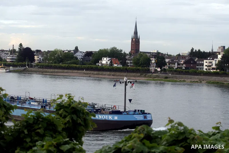 Ships in the River Rhine near the city of Bonn in Germany on 15 June 2012. The Rhine is one of the longest and most important rivers in Europe. It runs for over 1,232 km .Rhine flows through six countries -Switzerland, P...