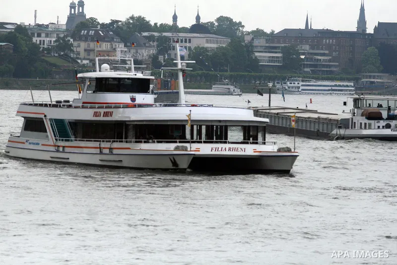 Ships in the River Rhine near the city of Bonn in Germany on 15 June 2012. The Rhine is one of the longest and most important rivers in Europe. It runs for over 1,232 km .Rhine flows through six countries -Switzerland, P...