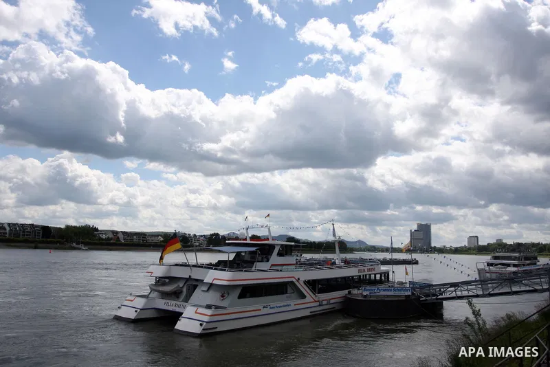 Ships in the River Rhine near the city of Bonn in Germany on 15 June 2012. The Rhine is one of the longest and most important rivers in Europe. It runs for over 1,232 km .Rhine flows through six countries -Switzerland, P...