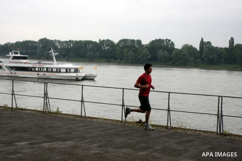 A German runs near the river Rhine near the city of Bonn in Germany on 15 June 2012. The Rhine is one of the longest and most important rivers in Europe. It runs for over 1,232 km .Rhine flows through six countries -Swit...