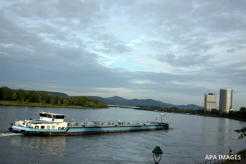 A ship in the River Rhine near the city of Bonn in Germany. The Rhine is one of the longest and most important rivers in Europe. It runs for over 1,232 km .Rhine flows through six countries -Switzerland, Principality of...