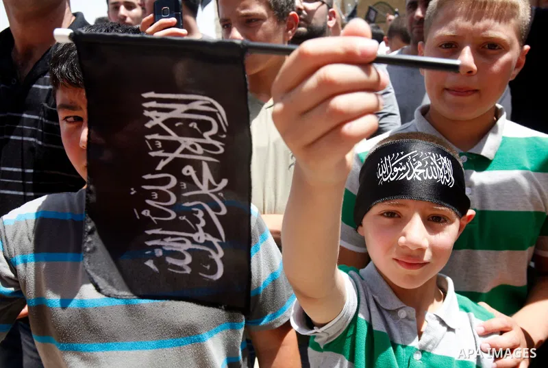 Dozens of members of the Islamic Liberation Movement, take part in a rally to mark anniversary of the overthrow of the Islamic Caliphate at Al-Aqsa Mosque following the friday prayers in the Jerusalem old city on 15 June...