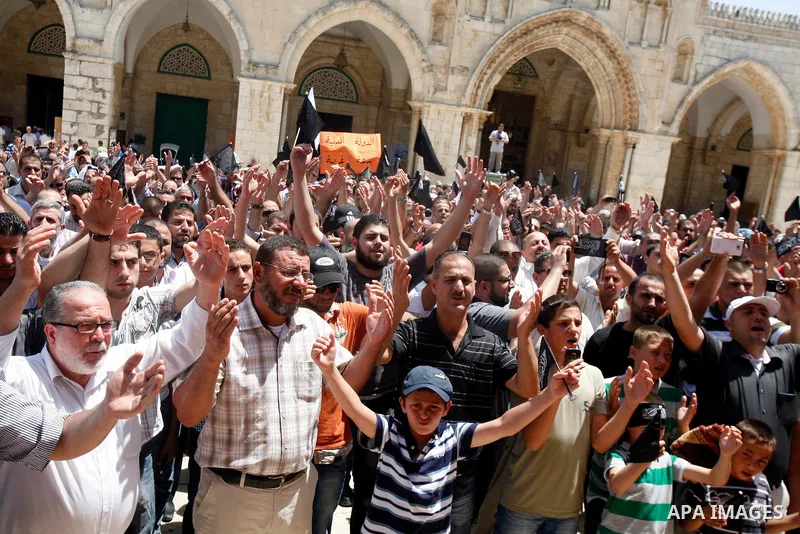 Dozens of members of the Islamic Liberation Movement, take part in a rally to mark anniversary of the overthrow of the Islamic Caliphate at Al-Aqsa Mosque following the friday prayers in the Jerusalem old city on 15 June...