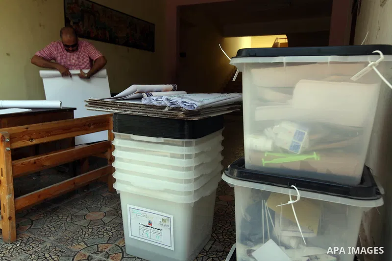 An Egyptian employee prepares a polling station on June 15, 2012 on the eve of Egypt's second round of presidential runoff elections. Egypt's transition to democracy was thrown into further disarray after its top court o...