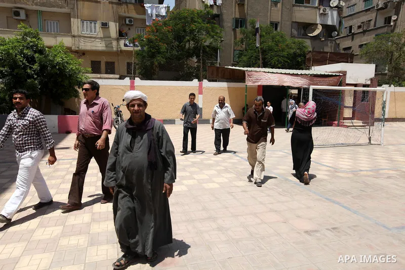 People arrive to cast their votes at a polling station in a school in Al-Sharqya, 60 km (37 miles) northeast of Cairo June 16, 2012. Egypt's first free presidential election concludes this weekend in a run-off between th...
