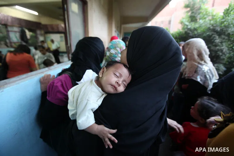 Egyptian women gather to cast their vote in Cairo on June 16, 2012. Egyptians were voting in a run-off presidential election pitting an Islamist against Hosni Mubarak's last premier amid political chaos highlighted by un...