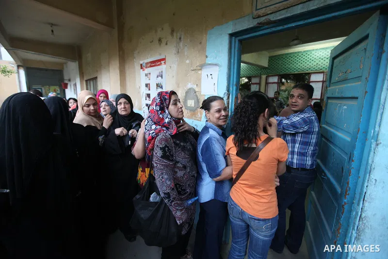Egyptian women gather to cast their vote in Cairo on June 16, 2012. Egyptians were voting in a run-off presidential election pitting an Islamist against Hosni Mubarak's last premier amid political chaos highlighted by un...