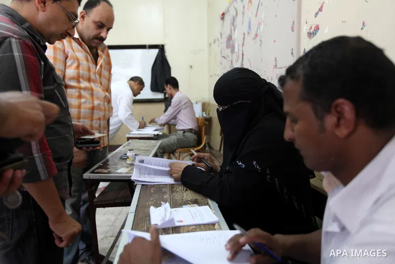 Egyptians gathers to cast their vote in Cairo on June 16, 2012. Egyptians were voting in a run-off presidential election pitting an Islamist against Hosni Mubarak's last premier amid political chaos highlighted by uncert...
