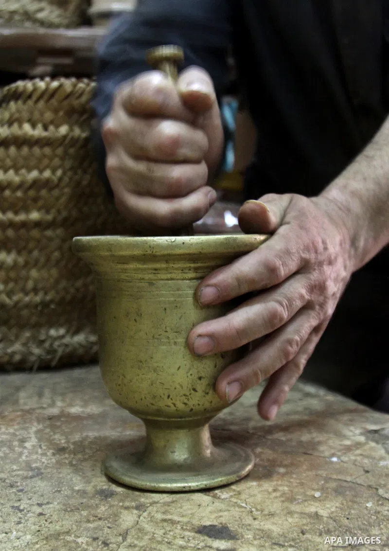 A Palestinian man makes coffe a factory in the West Bank city of Nablus on June 17, 2012. Nablus is famous of manufacturing several different types of spices. Photo by Nedal Eshtayah