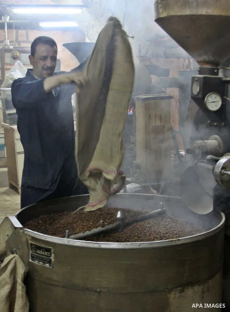 A Palestinian man makes coffe a factory in the West Bank city of Nablus on June 17, 2012. Nablus is famous of manufacturing several different types of spices. Photo by Nedal Eshtayah