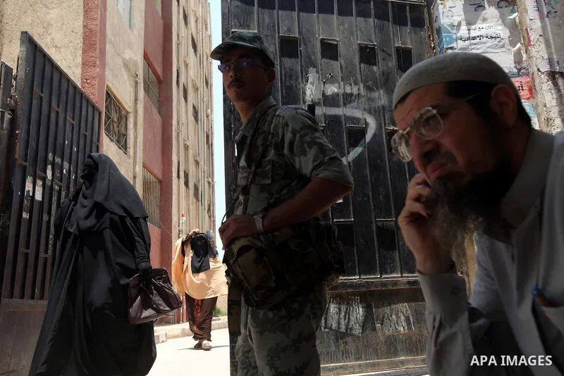 Voter out from a polling station after casting their vote during the second day of voting in Egypt's presidential election in Cairo June 17, 2012. A second day of voting on Sunday will deliver Egypt's first freely electe...