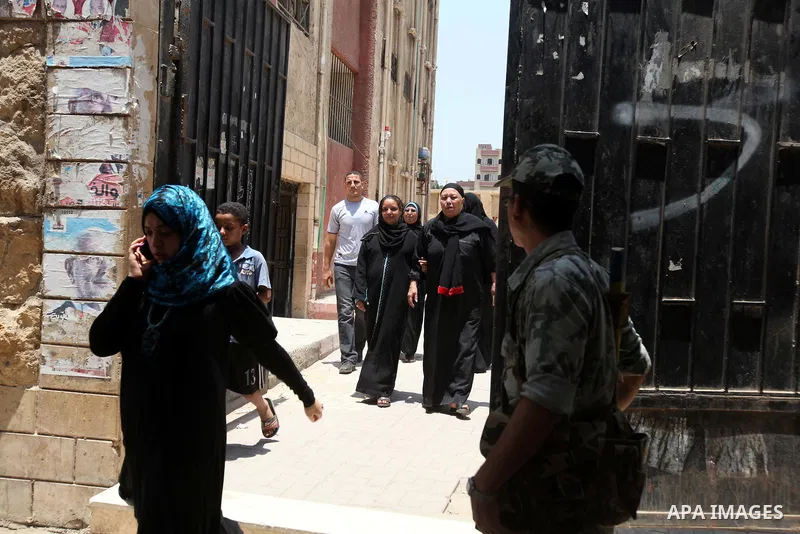 Voter out from a polling station after casting their vote during the second day of voting in Egypt's presidential election in Cairo June 17, 2012. A second day of voting on Sunday will deliver Egypt's first freely electe...