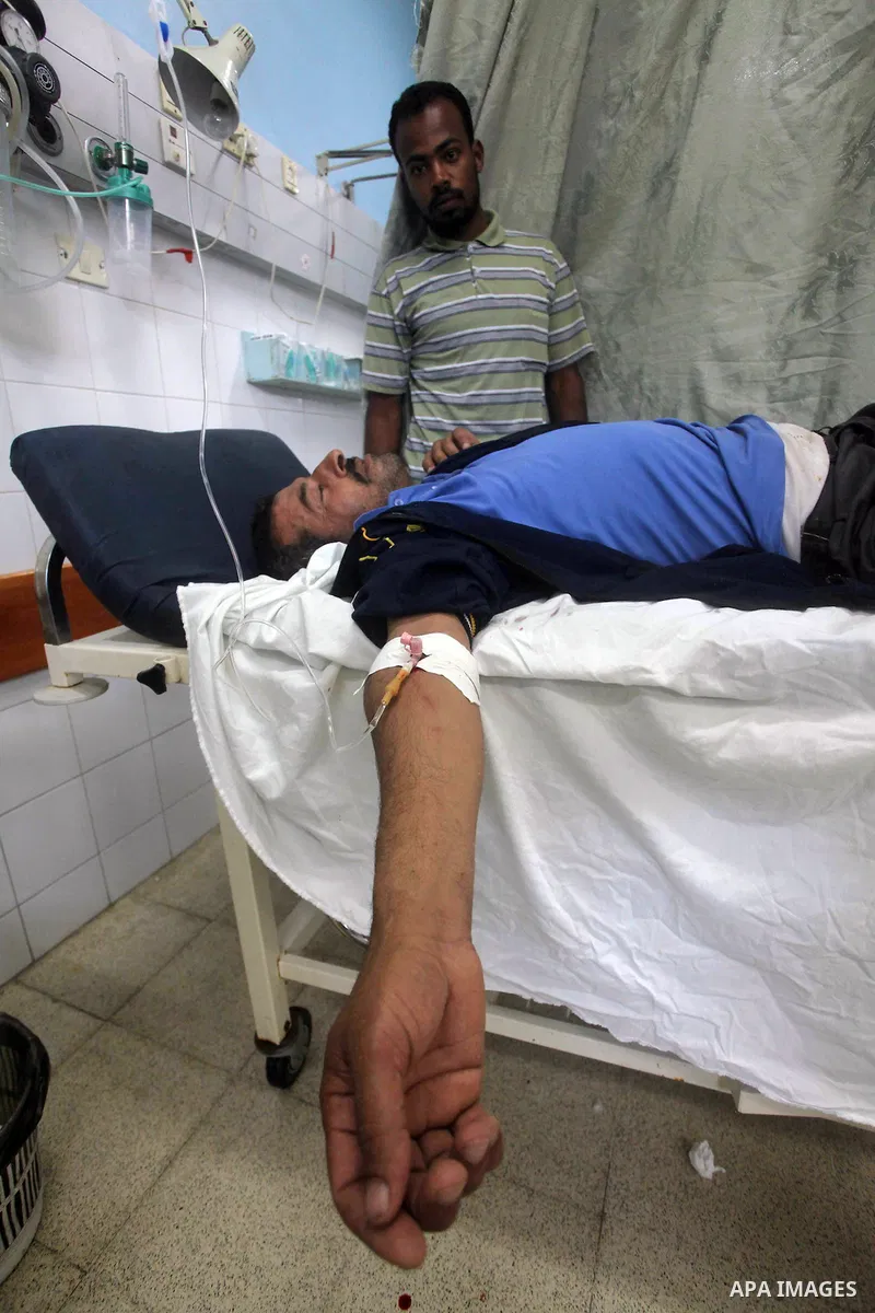 A Palestinian wounded man arrives to Al Aqsa hospital in the central Gaza Strip town of Deir Al Balah, on 17 June 2012. Israeli forces opened fire after incursion Gaza east border about 300 meters. Photo by Ashraf Amra