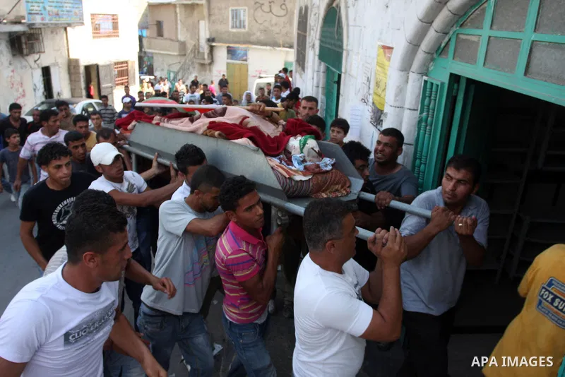 Palestinians carry the dead body of Naim al-Najar during his funeral in the West Bank village of Idhna, near Hebron, Sunday, June 17, 2012. An Israeli tow truck driver shot dead two Palestinians and wounded one Sunday du...