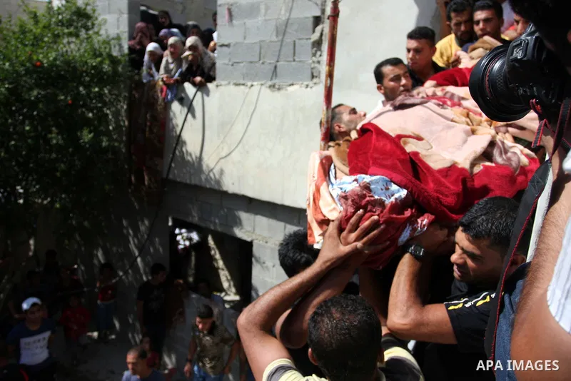 Palestinians carry the dead body of Naim al-Najar during his funeral in the West Bank village of Idhna, near Hebron, Sunday, June 17, 2012. An Israeli tow truck driver shot dead two Palestinians and wounded one Sunday du...