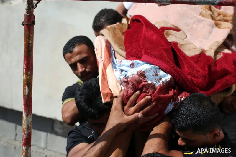 Palestinians carry the dead body of Naim al-Najar during his funeral in the West Bank village of Idhna, near Hebron, Sunday, June 17, 2012. An Israeli tow truck driver shot dead two Palestinians and wounded one Sunday du...