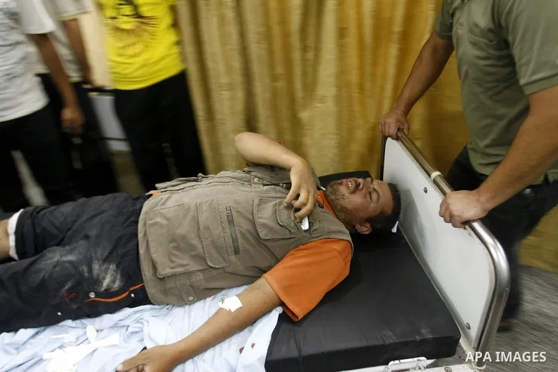 A Palestinian man wounded by Israeli air strikes on the southern Gaza Strip lays in a hospital bed, at the al-Najar hospital in Rafah, on June 18, 2012. Five Palestinians were wounded in the night between June 17 and 18...