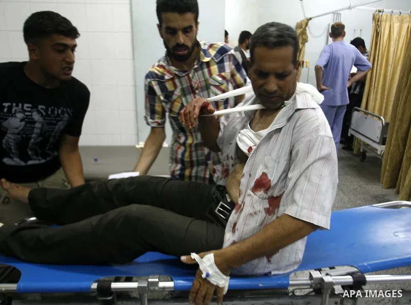 A Palestinian man wounded by Israeli air strikes on the southern Gaza Strip lays in a hospital bed, at the al-Najar hospital in Rafah, on June 18, 2012. Five Palestinians were wounded in the night between June 17 and 18...