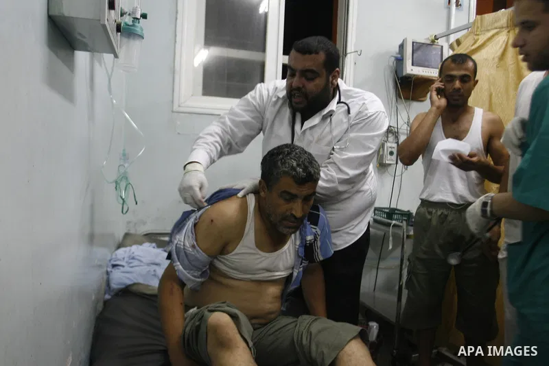 A Palestinian man wounded by Israeli air strikes on the southern Gaza Strip lays in a hospital bed, at the al-Najar hospital in Rafah, on June 18, 2012. Five Palestinians were wounded in the night between June 17 and 18...