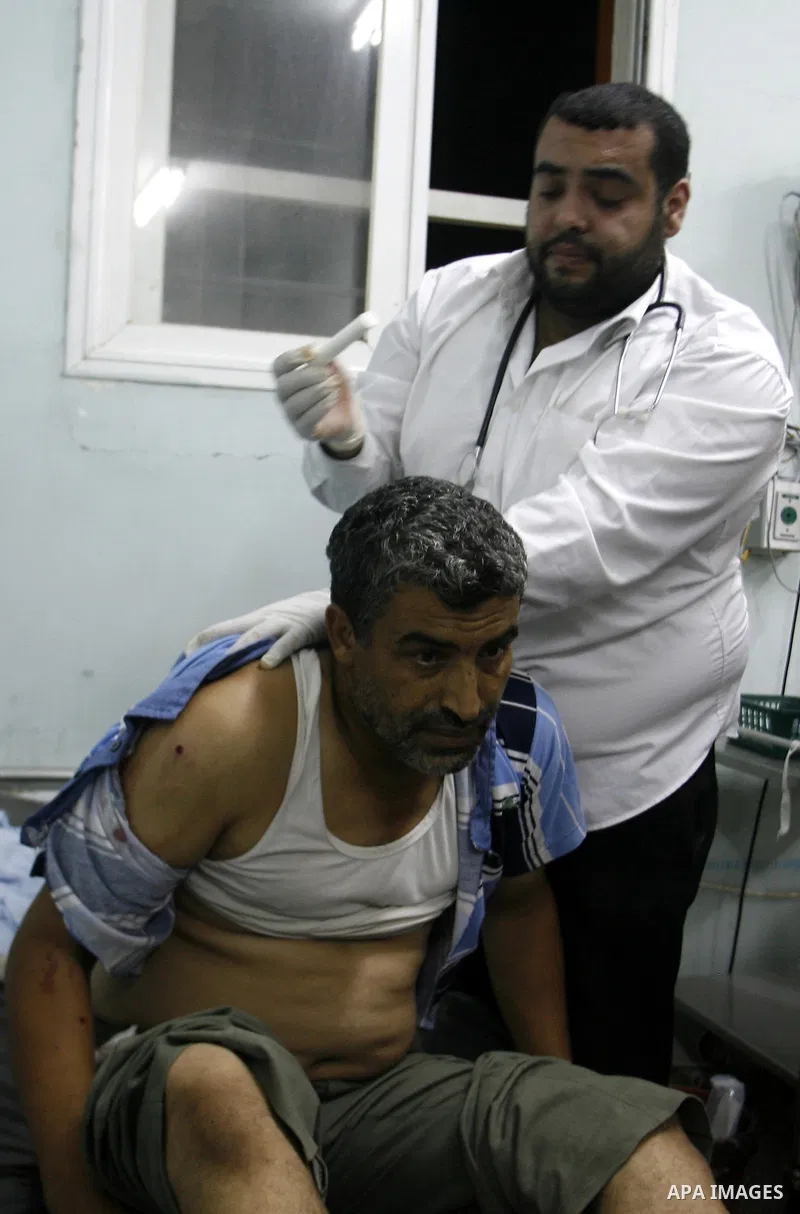 A Palestinian man wounded by Israeli air strikes on the southern Gaza Strip lays in a hospital bed, at the al-Najar hospital in Rafah, on June 18, 2012. Five Palestinians were wounded in the night between June 17 and 18...