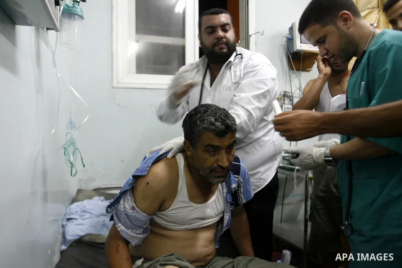 A Palestinian man wounded by Israeli air strikes on the southern Gaza Strip lays in a hospital bed, at the al-Najar hospital in Rafah, on June 18, 2012. Five Palestinians were wounded in the night between June 17 and 18...