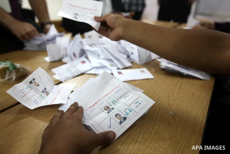 Electoral workers count ballots during the second day of voting in Egypt's presidential election, at a polling station in Cairo June 17, 2012. Egyptians began an anxious wait for their first freely elected president on S...