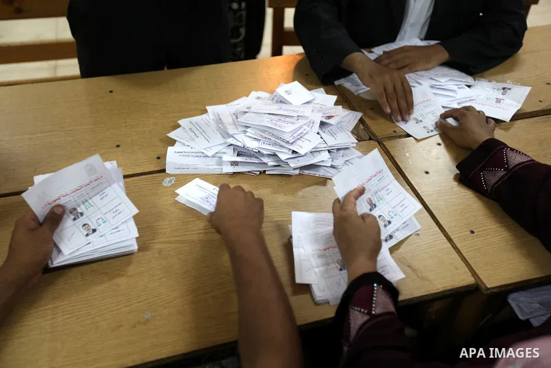 Electoral workers count ballots during the second day of voting in Egypt's presidential election, at a polling station in Cairo June 17, 2012. Egyptians began an anxious wait for their first freely elected president on S...