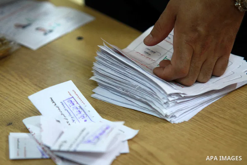 Electoral workers count ballots during the second day of voting in Egypt's presidential election, at a polling station in Cairo June 17, 2012. Egyptians began an anxious wait for their first freely elected president on S...