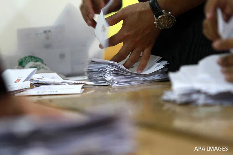 Electoral workers count ballots during the second day of voting in Egypt's presidential election, at a polling station in Cairo June 17, 2012. Egyptians began an anxious wait for their first freely elected president on S...