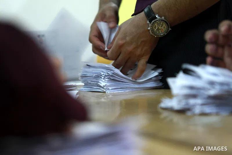 Electoral workers count ballots during the second day of voting in Egypt's presidential election, at a polling station in Cairo June 17, 2012. Egyptians began an anxious wait for their first freely elected president on S...
