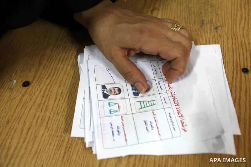 Electoral workers count ballots during the second day of voting in Egypt's presidential election, at a polling station in Cairo June 17, 2012. Egyptians began an anxious wait for their first freely elected president on S...
