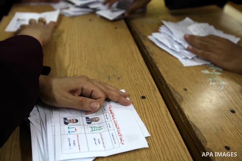 Electoral workers count ballots during the second day of voting in Egypt's presidential election, at a polling station in Cairo June 17, 2012. Egyptians began an anxious wait for their first freely elected president on S...