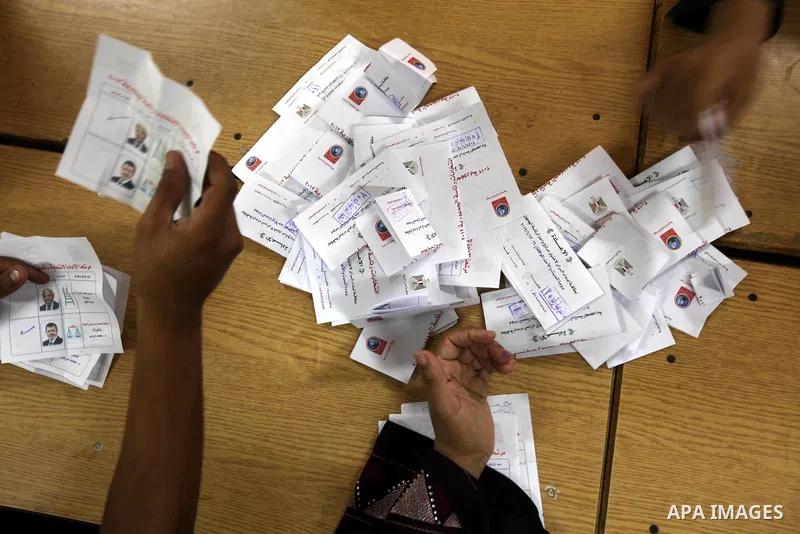 Electoral workers count ballots during the second day of voting in Egypt's presidential election, at a polling station in Cairo June 17, 2012. Egyptians began an anxious wait for their first freely elected president on S...