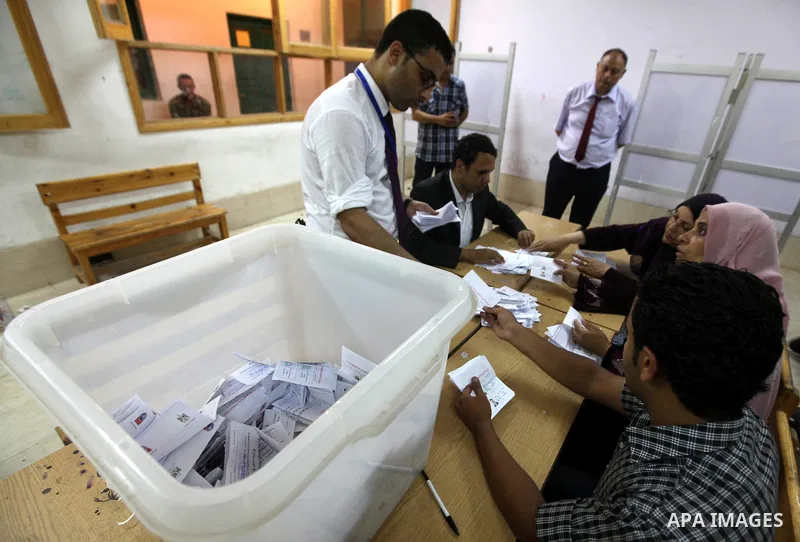 Electoral workers count ballots during the second day of voting in Egypt's presidential election, at a polling station in Cairo June 17, 2012. Egyptians began an anxious wait for their first freely elected president on S...