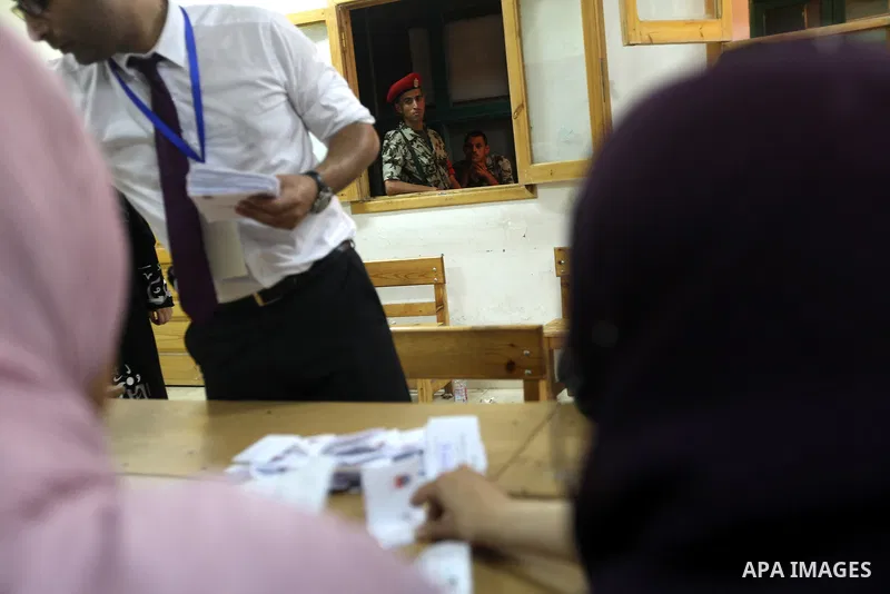 Electoral workers count ballots during the second day of voting in Egypt's presidential election, at a polling station in Cairo June 17, 2012. Egyptians began an anxious wait for their first freely elected president on S...