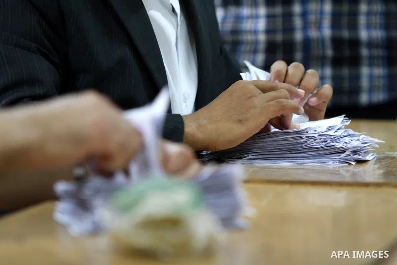 Electoral workers count ballots during the second day of voting in Egypt's presidential election, at a polling station in Cairo June 17, 2012. Egyptians began an anxious wait for their first freely elected president on S...