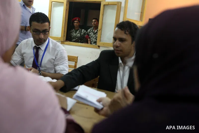 Electoral workers count ballots during the second day of voting in Egypt's presidential election, at a polling station in Cairo June 17, 2012. Egyptians began an anxious wait for their first freely elected president on S...