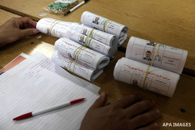 Electoral workers count ballots during the second day of voting in Egypt's presidential election, at a polling station in Cairo June 17, 2012. Egyptians began an anxious wait for their first freely elected president on S...