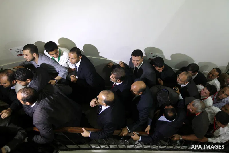Egypt's Muslim Brotherhood candidate Mohammed Mursi waves amongst his supporters after the announcement of presidential election results at the electoral headquarters in Cairo on June 18, 2012. The campaign of Egyptian p...